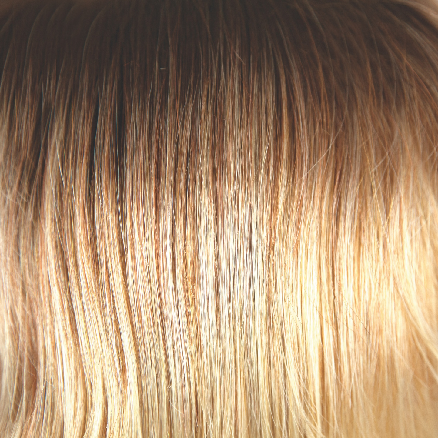 Melted Sunset - An extremely popular and beautiful color. Similar to melted marshmallow but much, much warmer and golden. Starting with dark golden pearl brown flowing into medium amber blonds with a saffron sizzle and bright gold sunbeam blonds on the ends and tips.