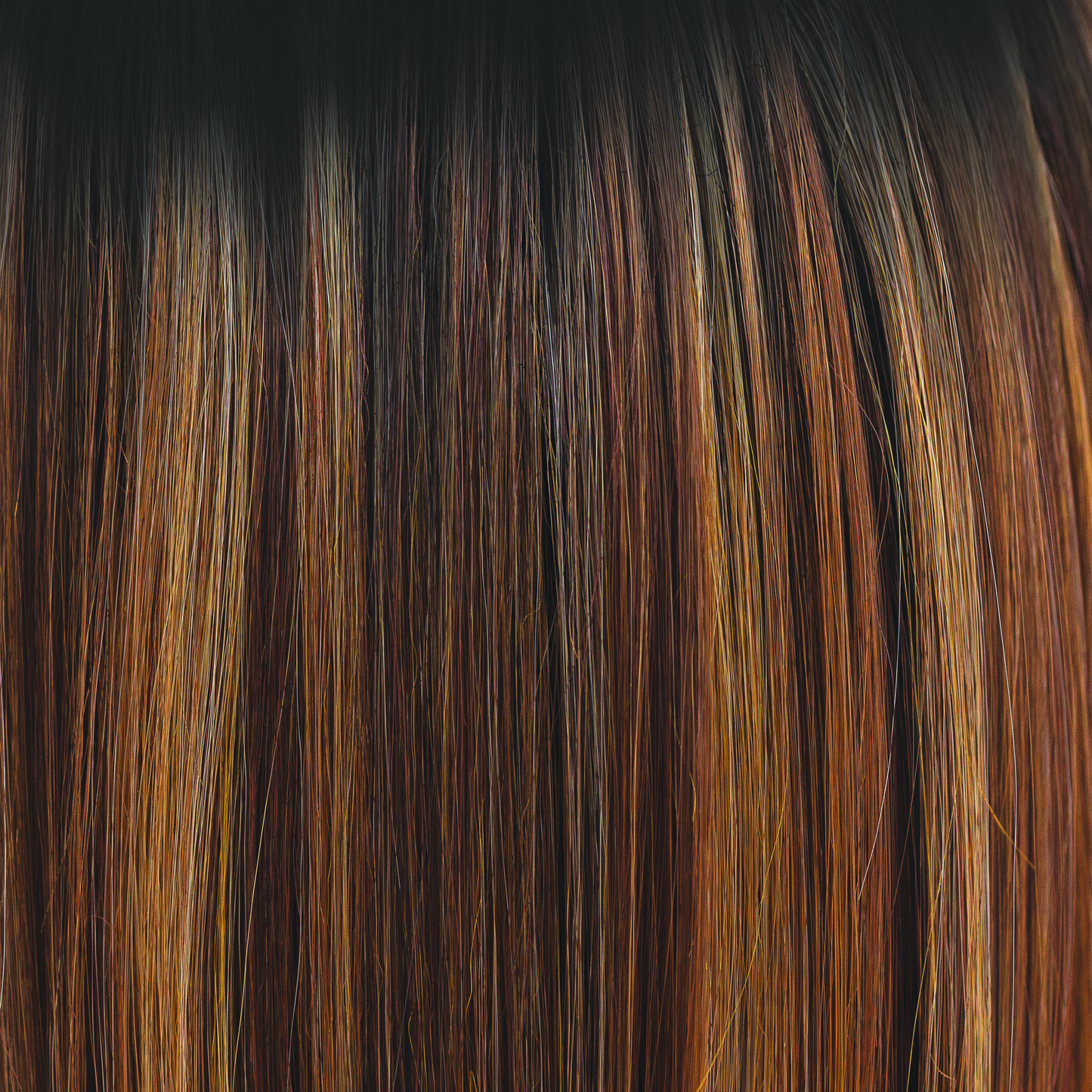 Molten Amber - A dark brown rooted color blending into chestnut and deep copper tones, with flecks of creamy golden fine blonds. Simply stunning and very wearable. Molten Amber oozes class and is a high heat color.