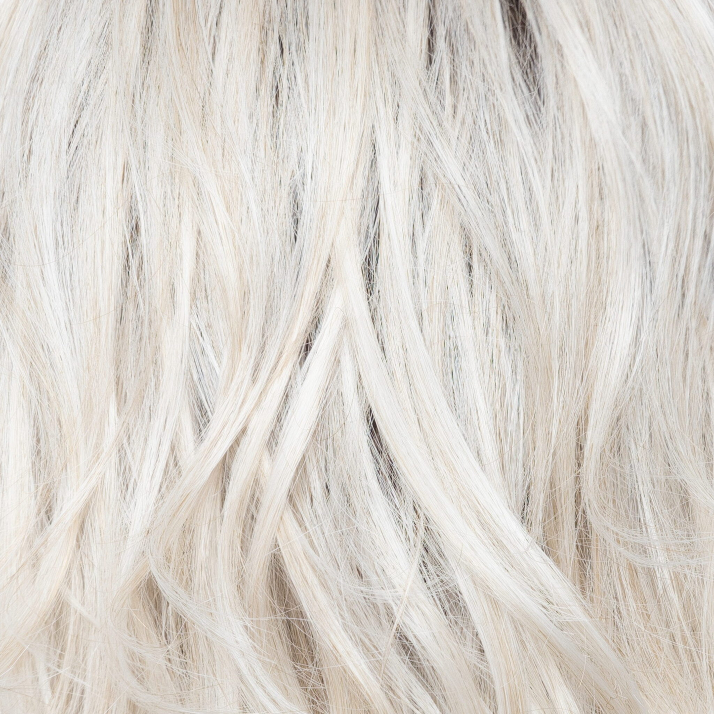 White Rose Blond-R  -  A white blond base with subtle warm brown highlights. The medium-brown root creates a vibrant appearance.