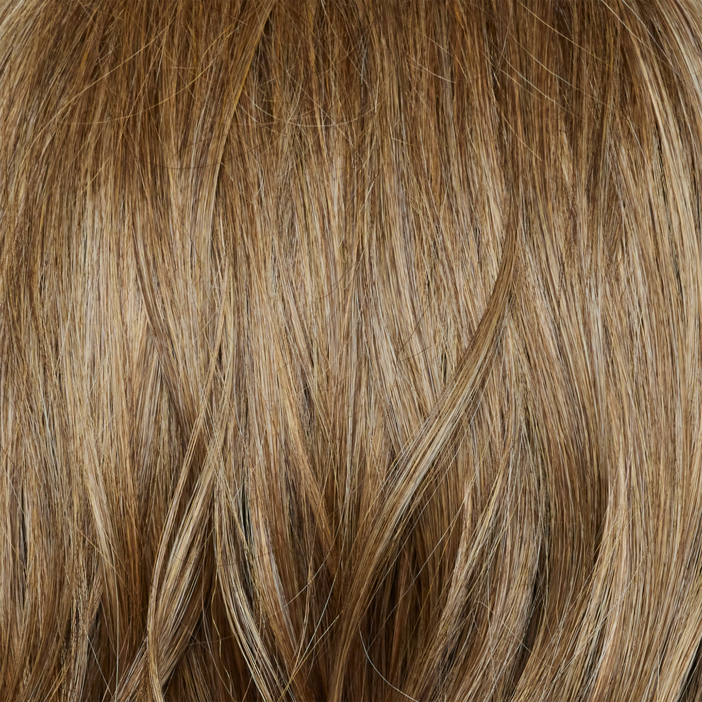 Caramel Biscotti  -  A beautiful mid/dark blond hair color with delicate caramel blond highlights seamlessly blended throughout, creating a warm and inviting look.