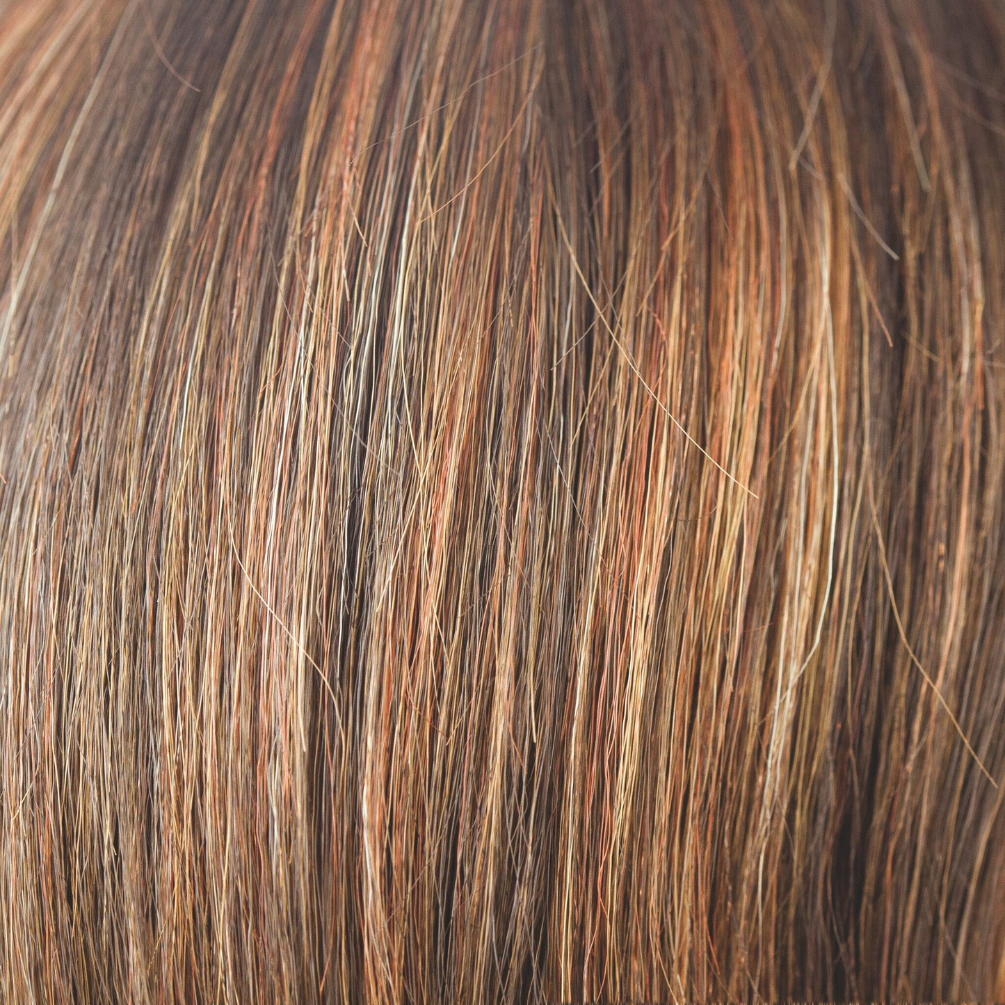 Dark Rust  -  A medium to light multi-tonal red with highlights and lowlights of rusty red shades and apricot bronze with tastefully placed slices of Tuscan terracotta.