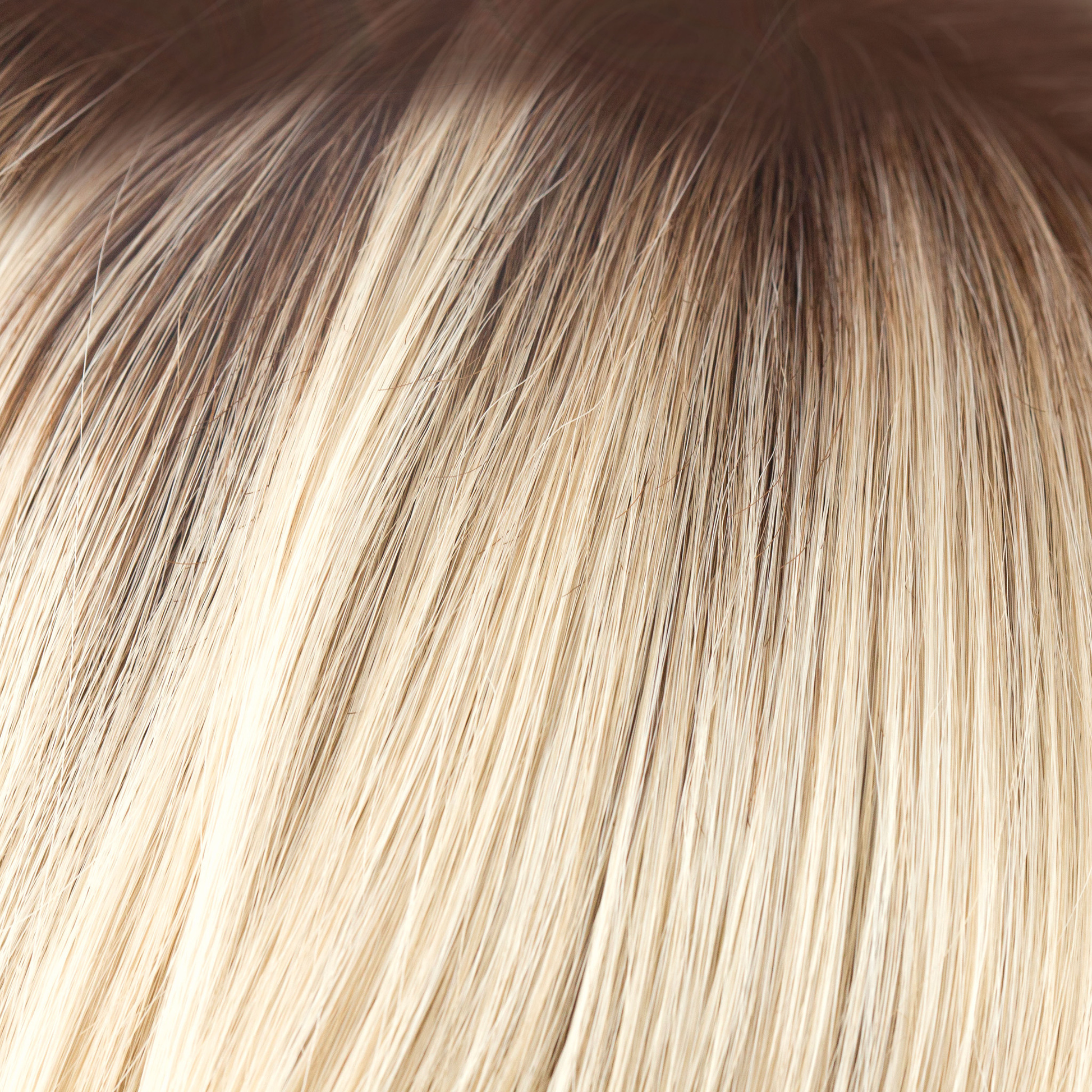 NM Champagne-R  -  A luxurious color with many fine tones of blond. Cream blonds, champagne hues and pale gold undertones make the blond a work of art! The medium warm brown root gives it the most natural of regrowths and keeps it looking very realistic.