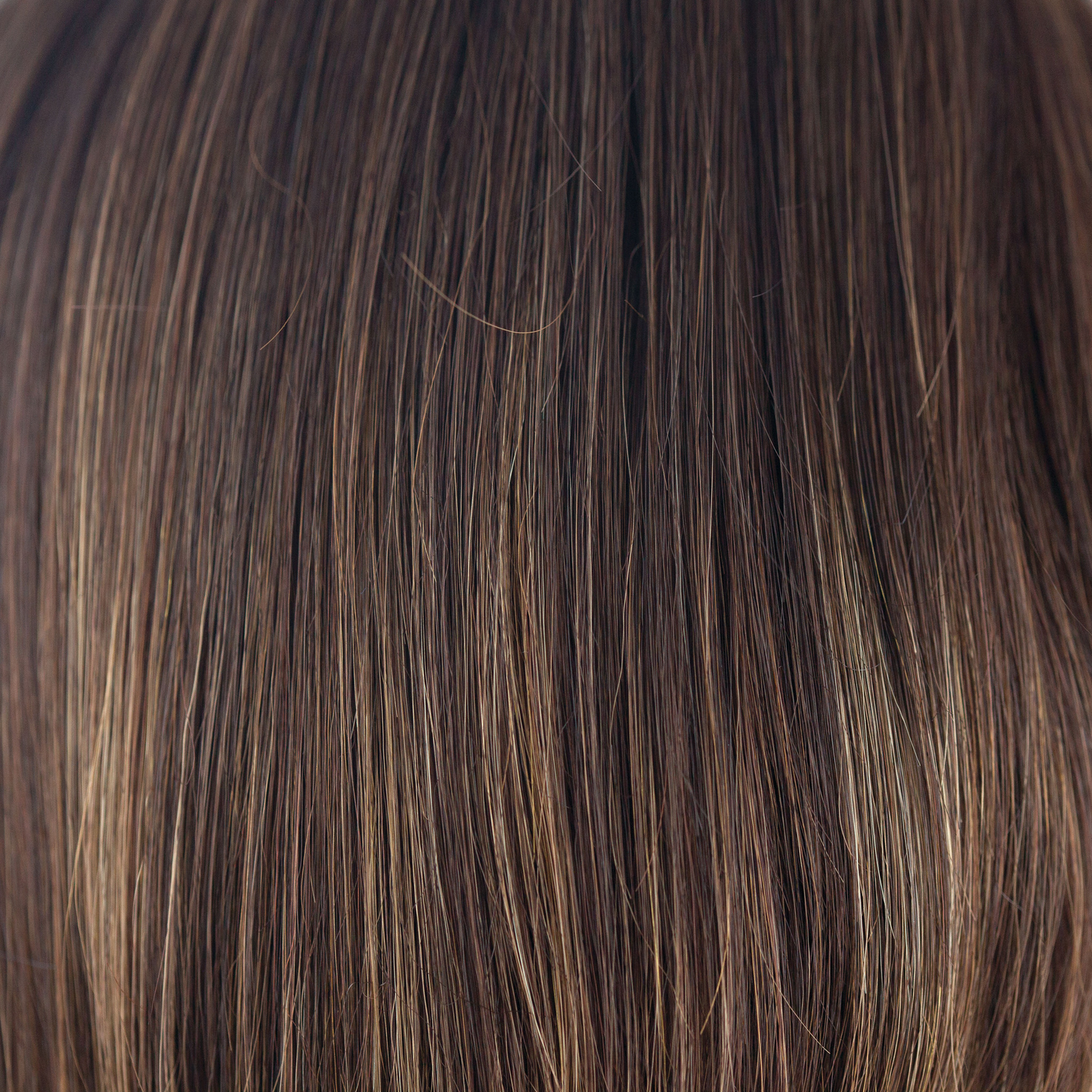 NM Coffee Latte  -  A Cappucino-base with a mix of warm medium brown and medium golden blond highlights. With strategically placed highlights throughout, the warm toned color will highlight and warm the skin tone.