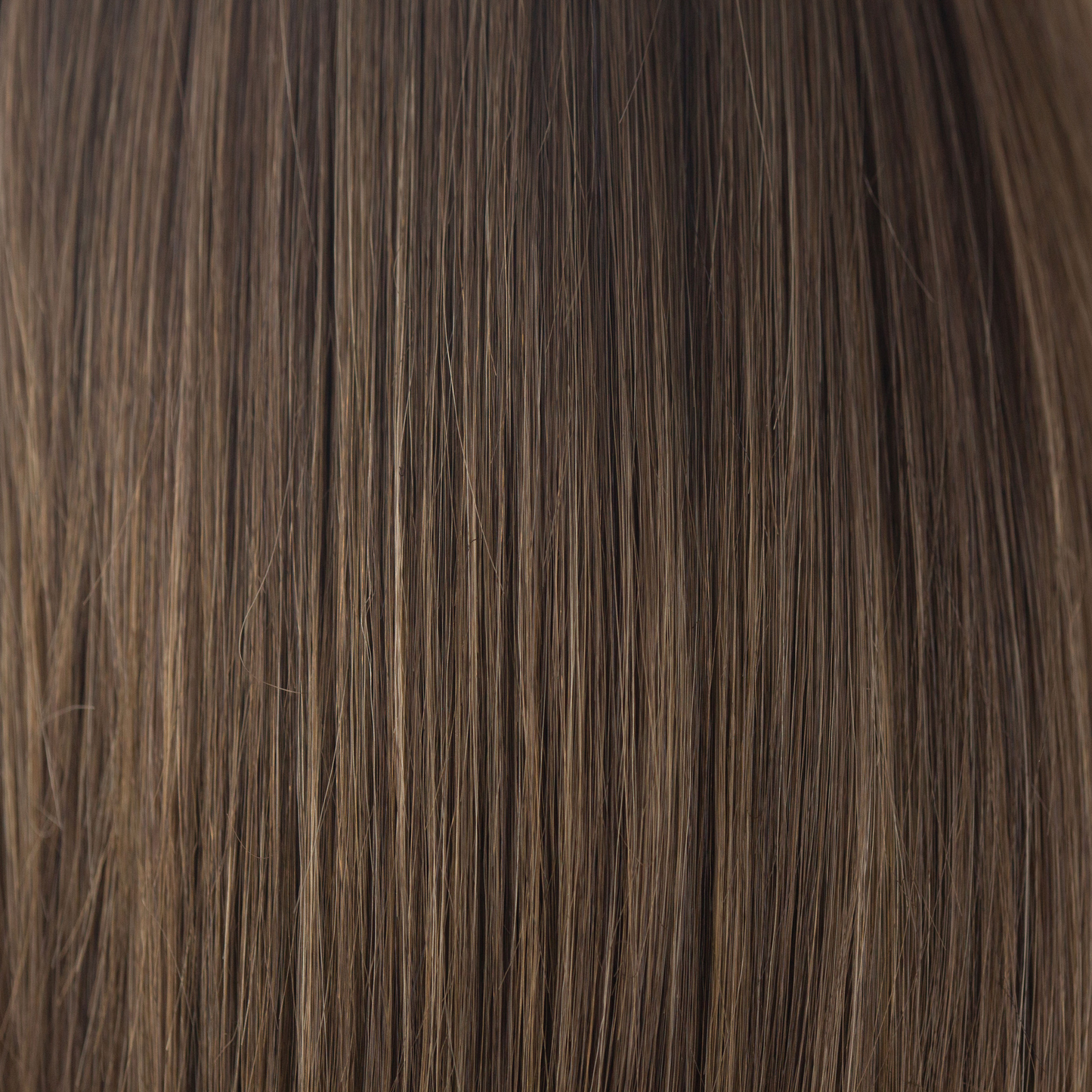 NM Medium Brown  -  This cool-toned medium brown is a perfect fusion for both brown and blond enthusiasts. Medium Brown is a beautiful blend of both worlds - an ageless classic.