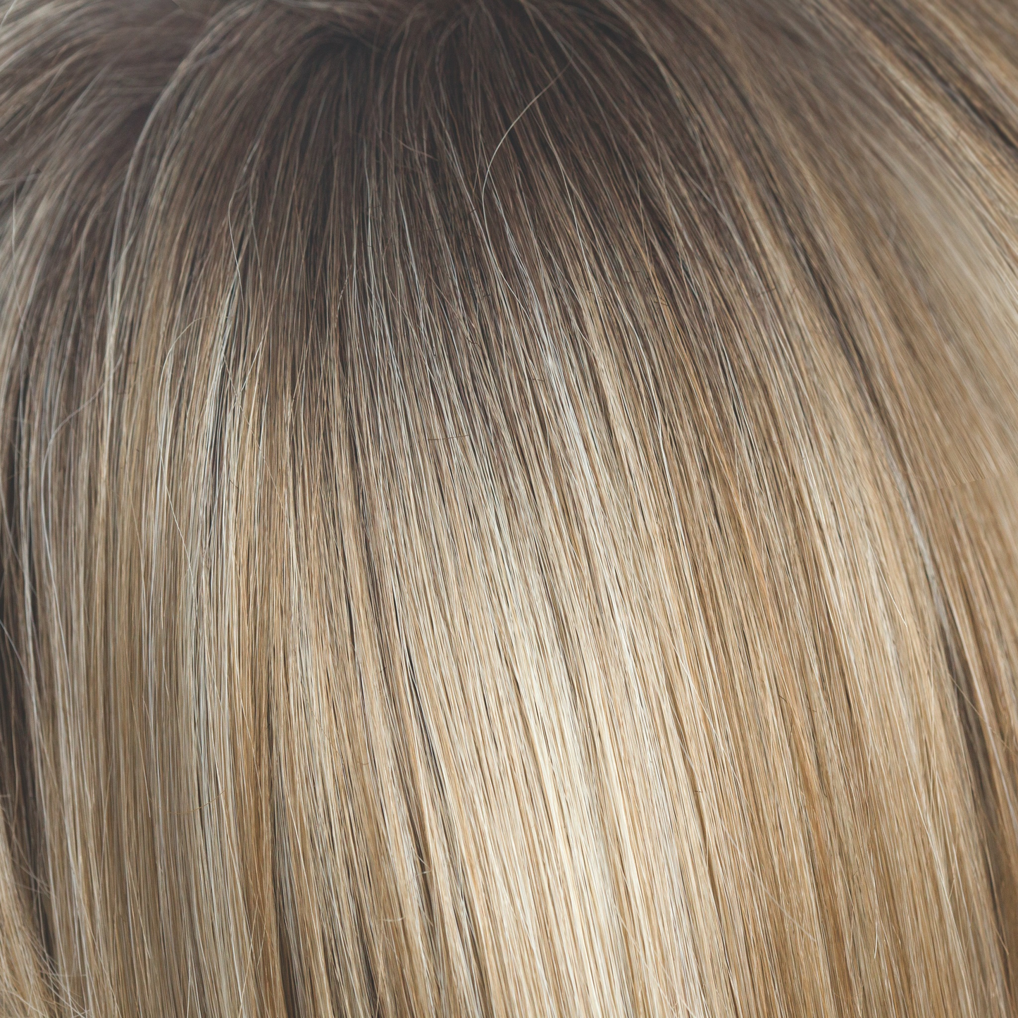 Rose Gold-R  -  A medium to dark golden brown and blends into the rose gold blond with rooted blond and hints of rose and hues of peachy coral. 