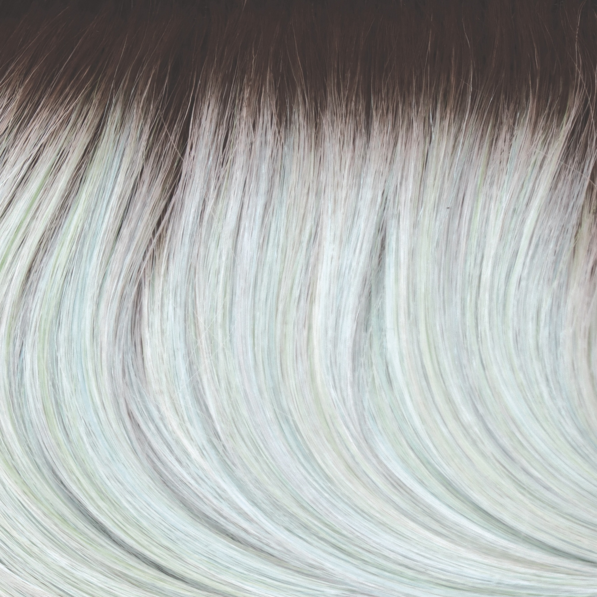 Seaglass-R  -  This beige brown rooted color is captivating. The root seamlessly smudges into a pale peppermint green with hints of blue jade.