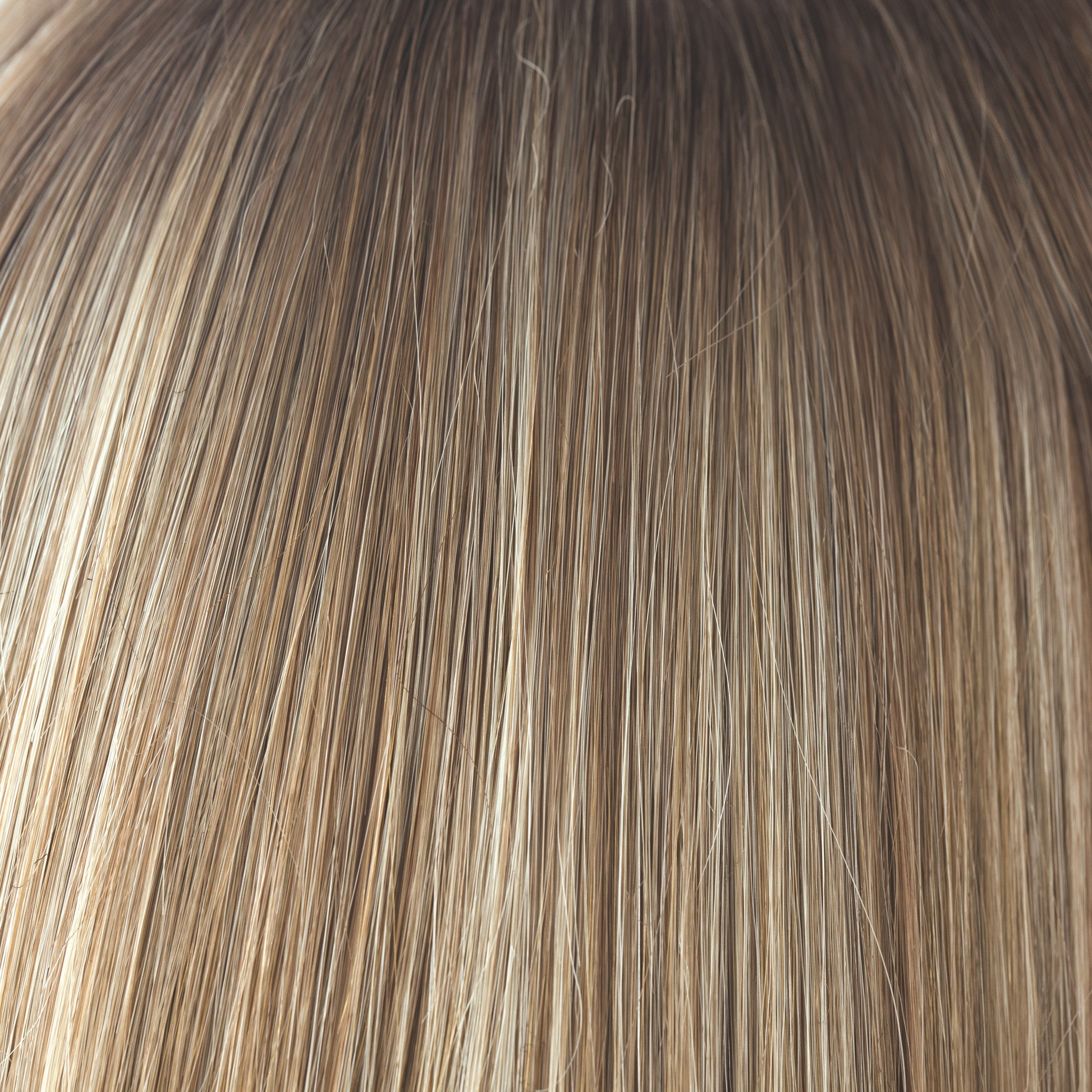 Spring Honey-R  -  A natural and the root tone is a medium gold honey brown. There is a mix of white blonde highlights and strawberry blonds. Complemented with medium velvet brown undertones.